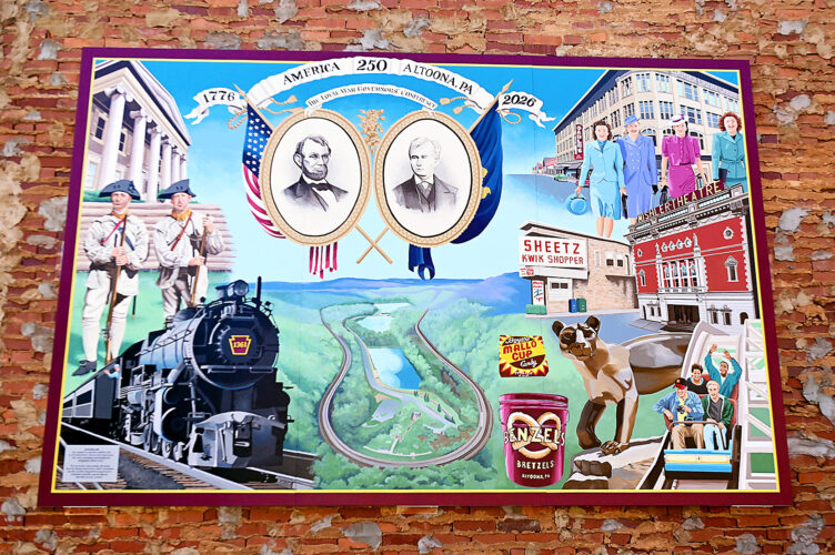 Creating history: AAHS students, teachers paint mural depicting iconic images of city